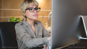 Young-Woman-Glasses-Computer-Monitor-Working-Research